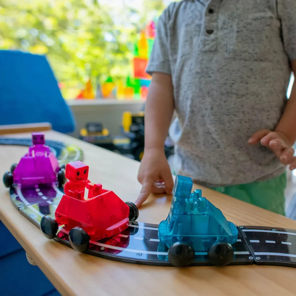 Colorful toy cars on a track with a child