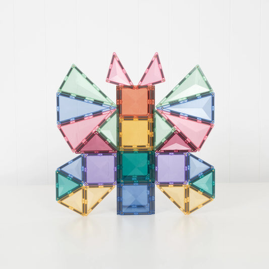 A colorful magnetic tile structure built into a butterfly-like shape, made from translucent square and triangular pieces