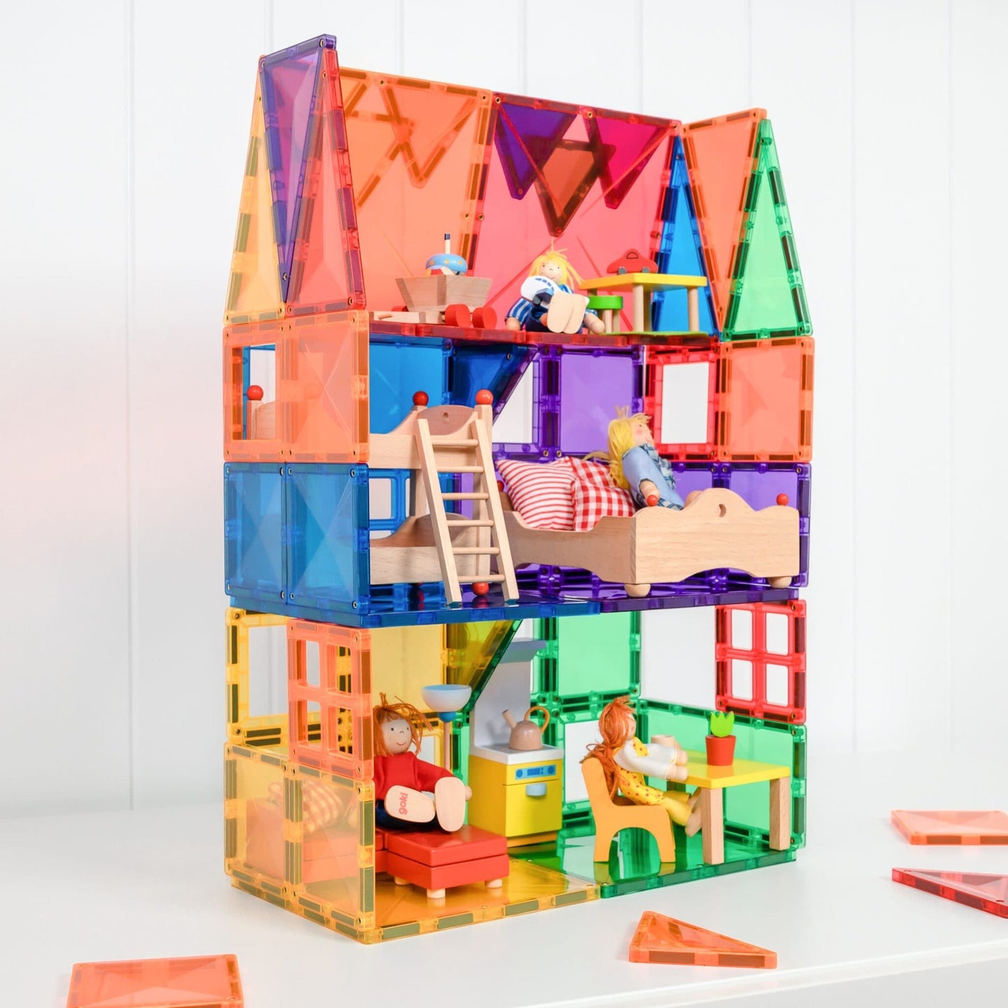 Colorful toy house with transparent walls and magnetic blocks