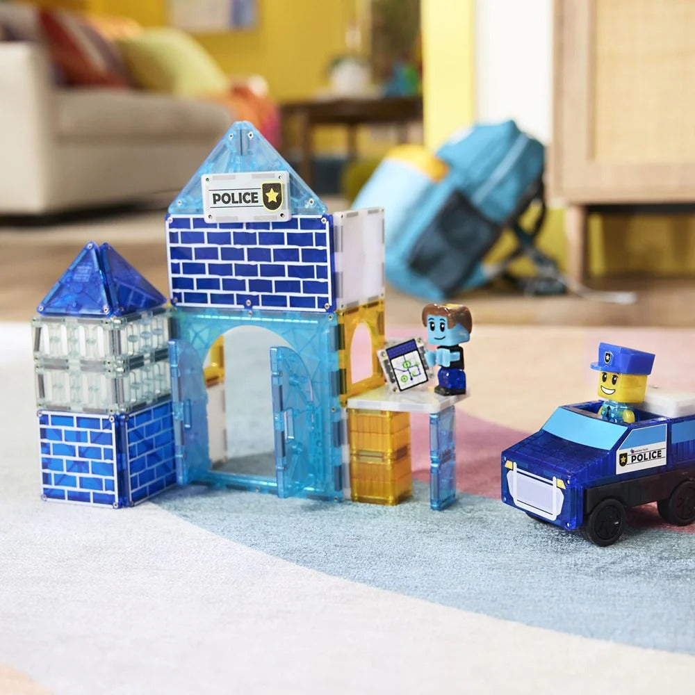 Toy police station set with a toy car and figures