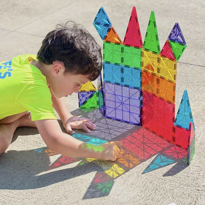 Child playing with colorful building blocks 