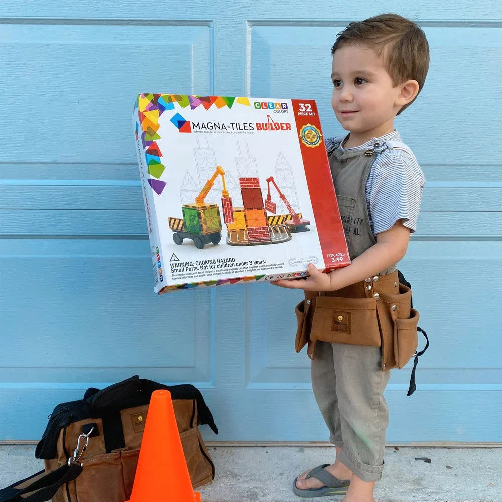 Child holding a Magna-Tiles Builder set box 