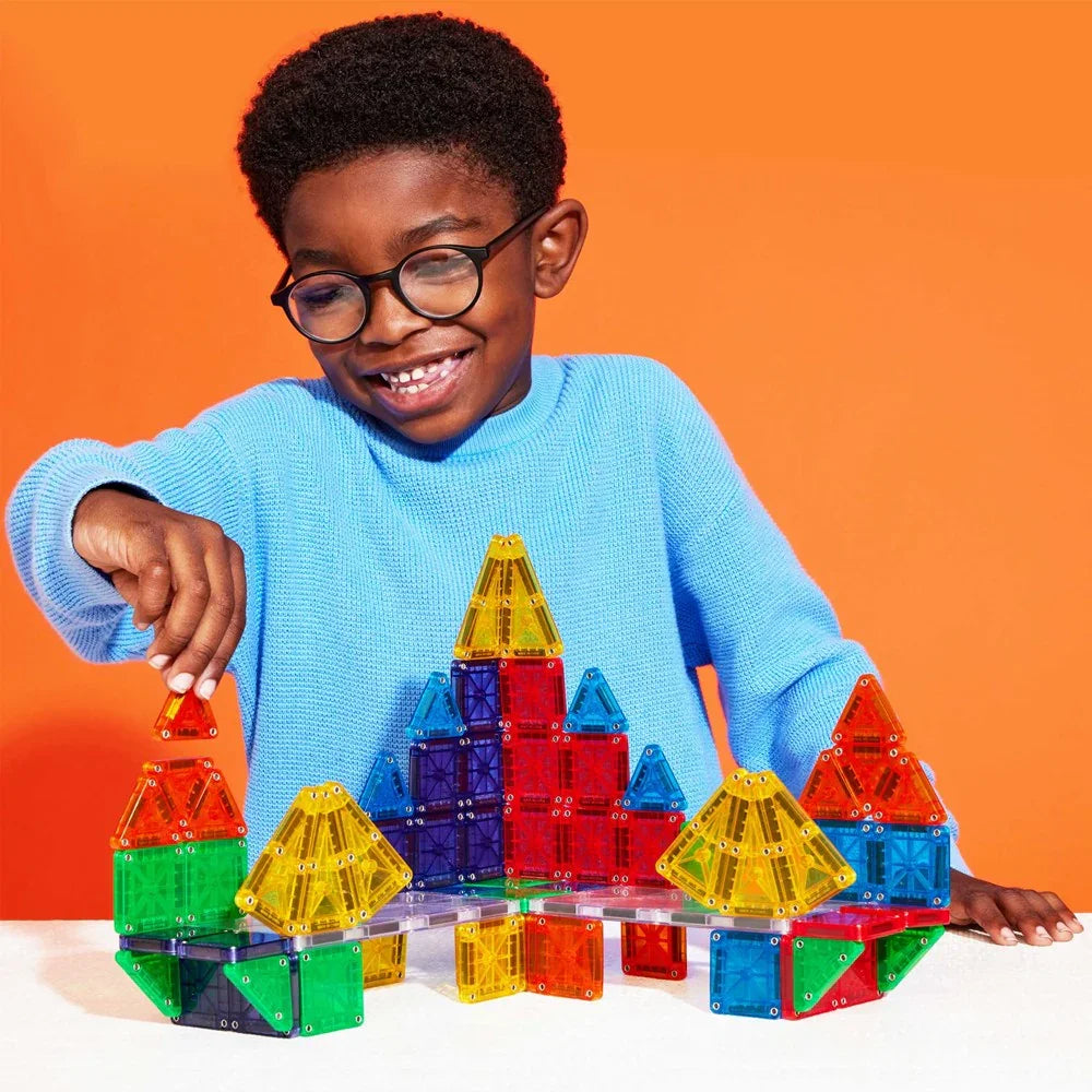 Child playing with colorful building blocks 