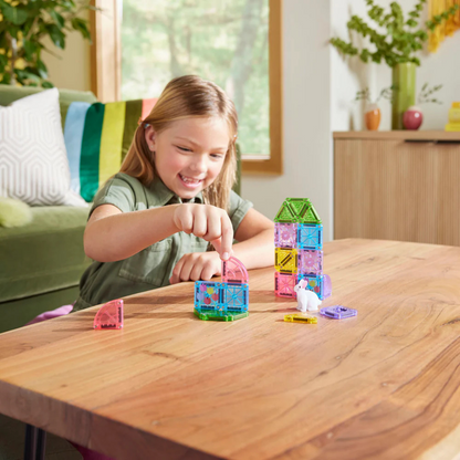 Child playing with colorful magnetic building blocks 