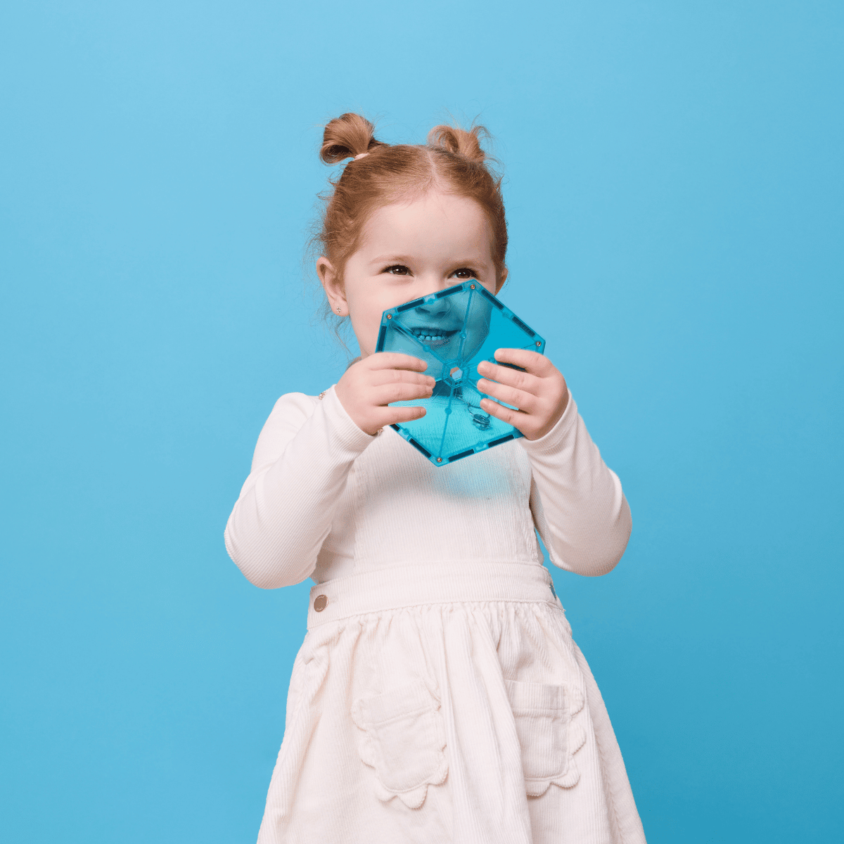 Child holding a blue mask