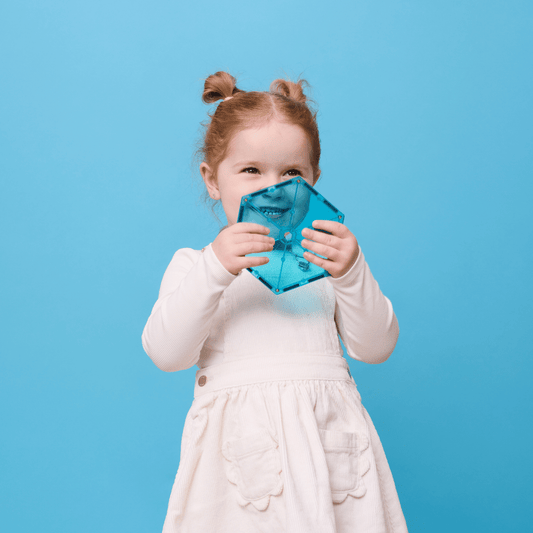 Child holding a blue mask