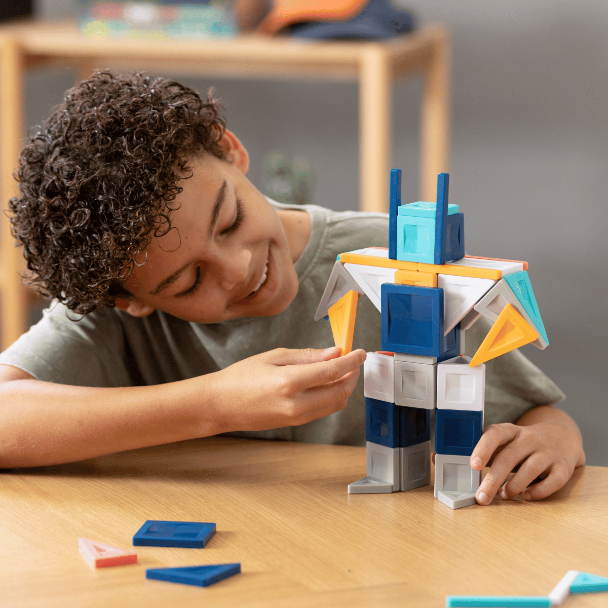 Child playing with a colorful building block set 