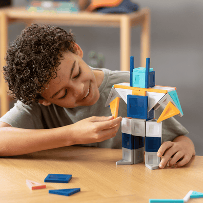 Child playing with a colorful building block set 