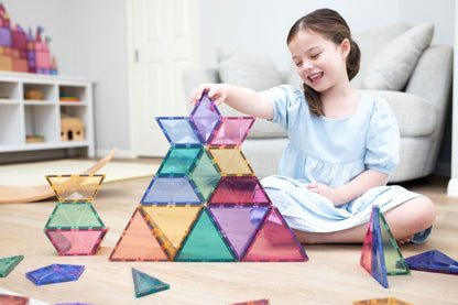 Child playing with colorful magnetic building blocks