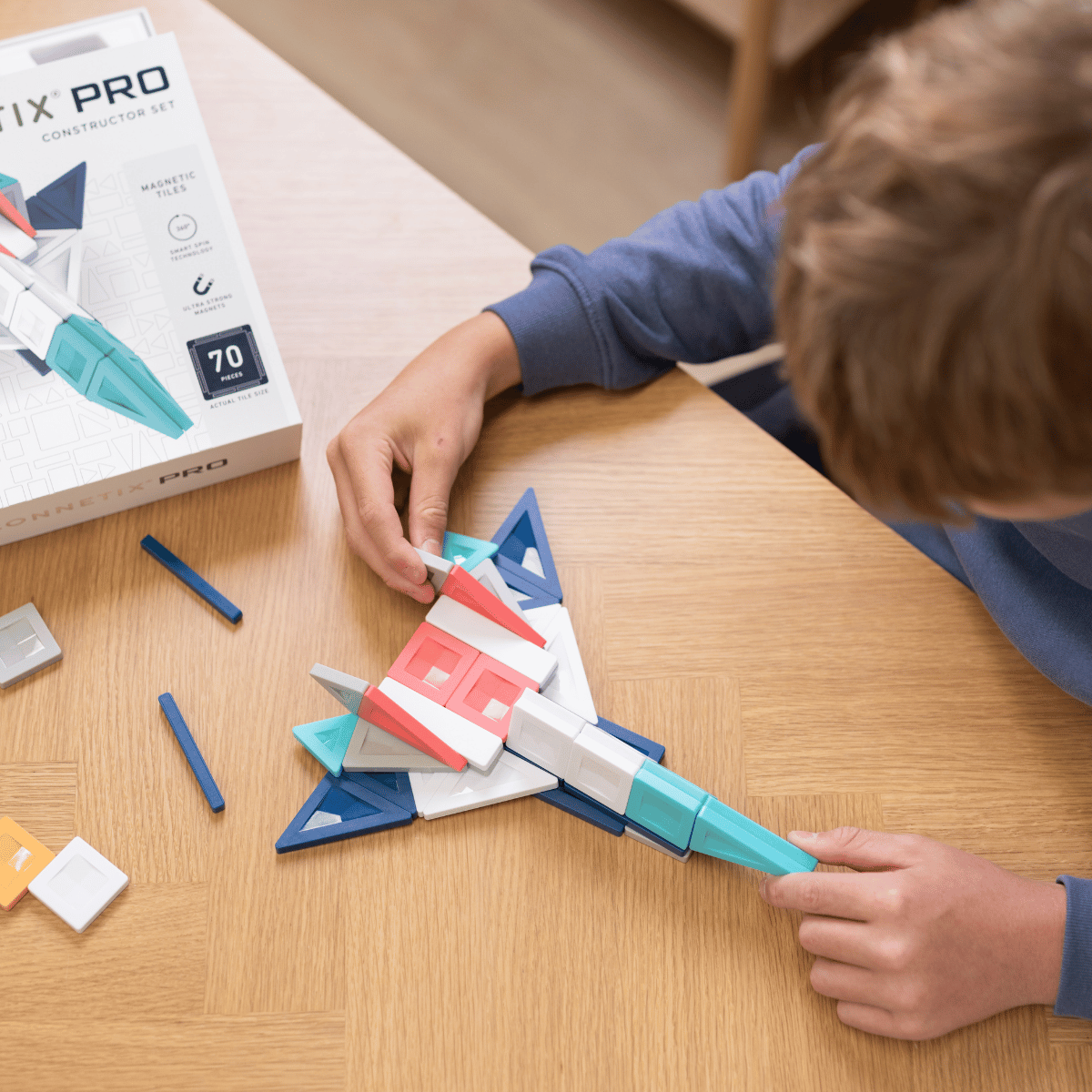 Child playing with a geometric construction set 