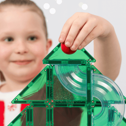 Children play with christmas tree