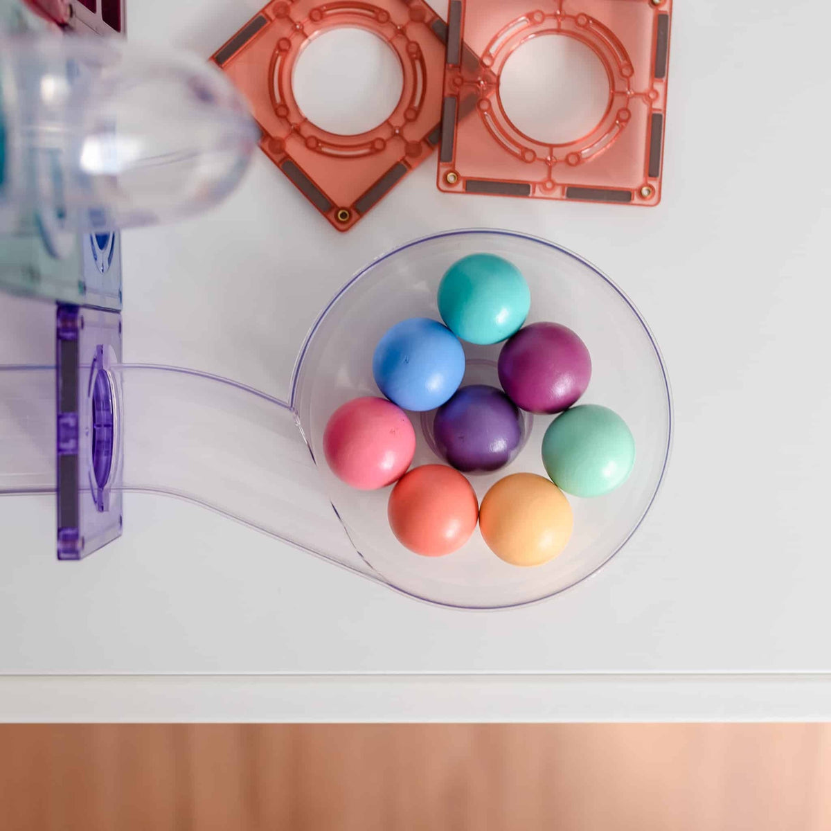 Colorful balls in a clear container