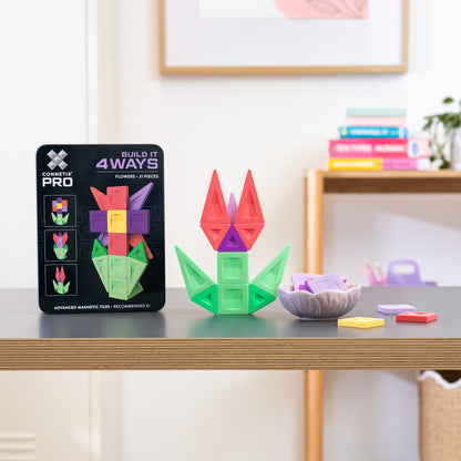 A set of colorful magnetic building tiles arranged into a flower shape 