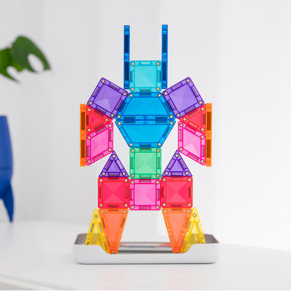 Colorful magnetic building toy assembled into a humanoid robot figure, standing