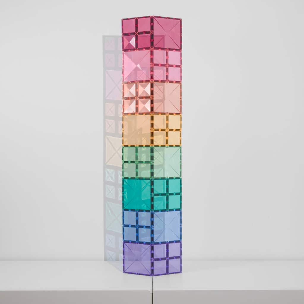 Colorful geometric tower made of interlocking cubes 
