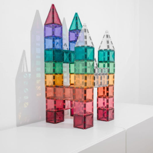 Colorful transparent building blocks stacked to resemble a cityscape 