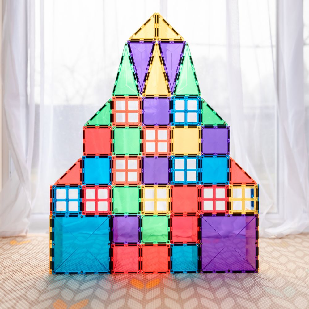 Creative magnetic tile tower design made with Connetix rainbow magnetic tiles
