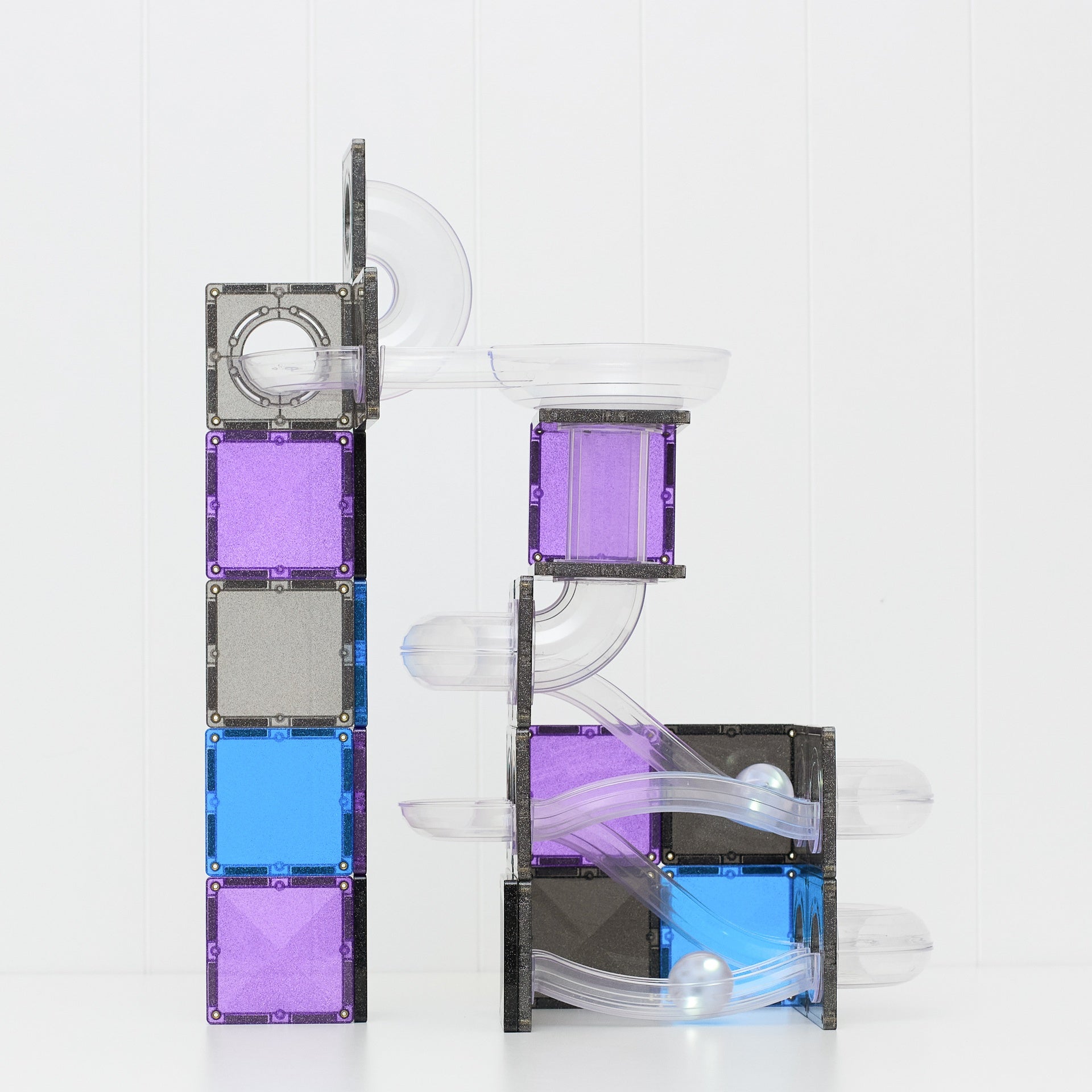 Magnetic building blocks set with clear plastic tubes and tracks