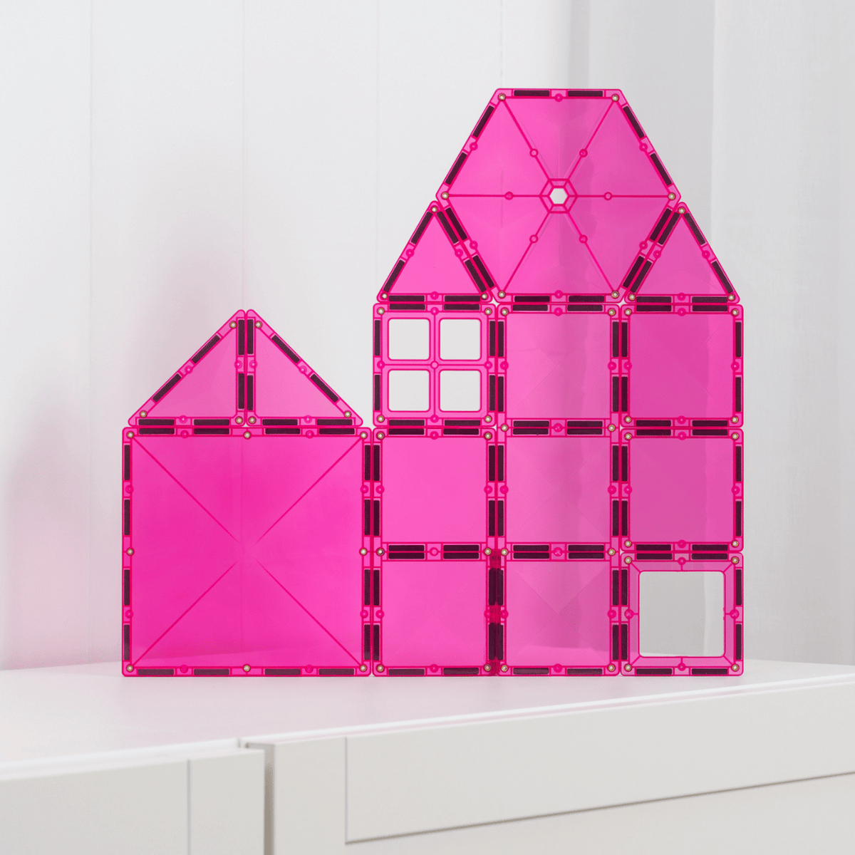 Pink transparent house-shaped building block 