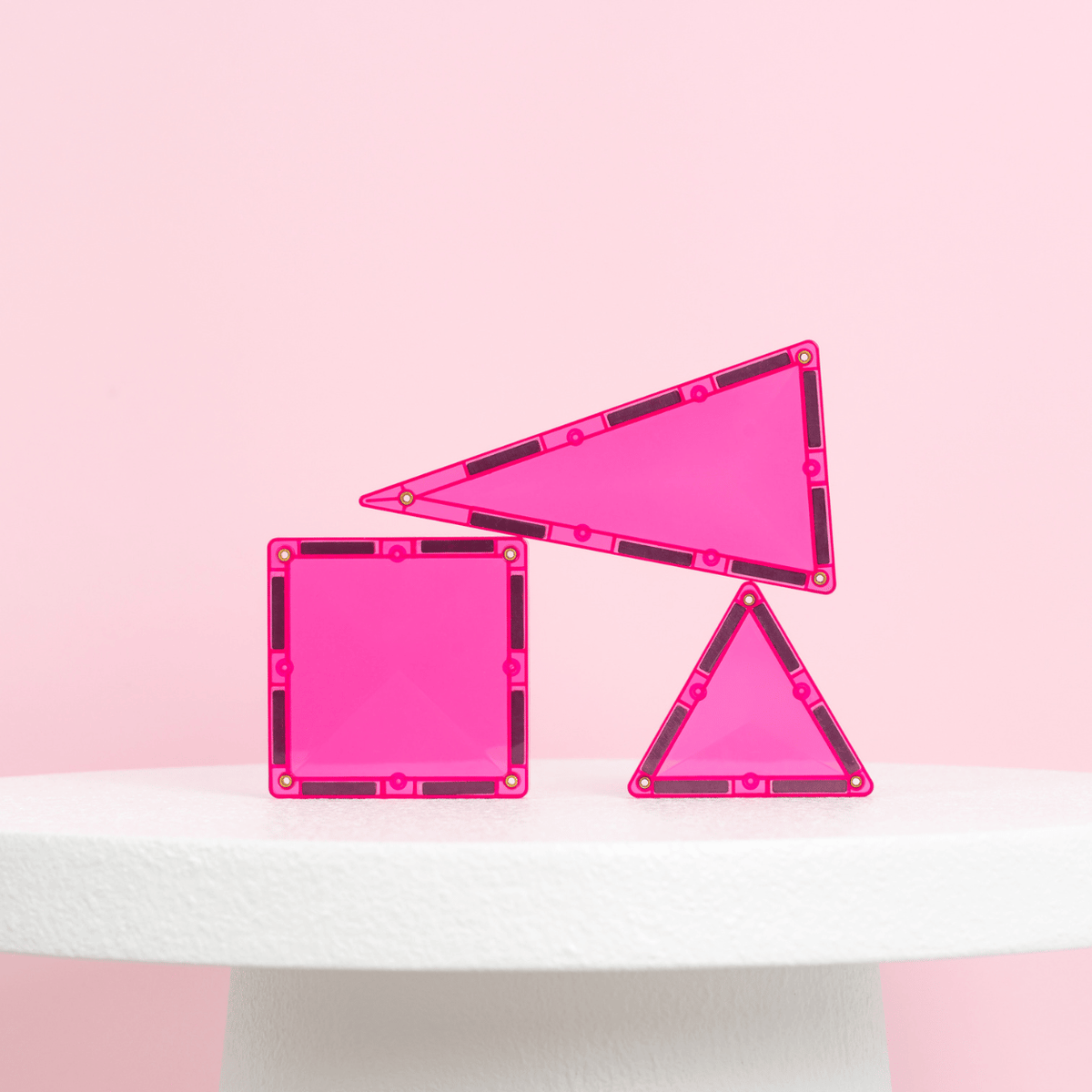 Three pink geometric frames
