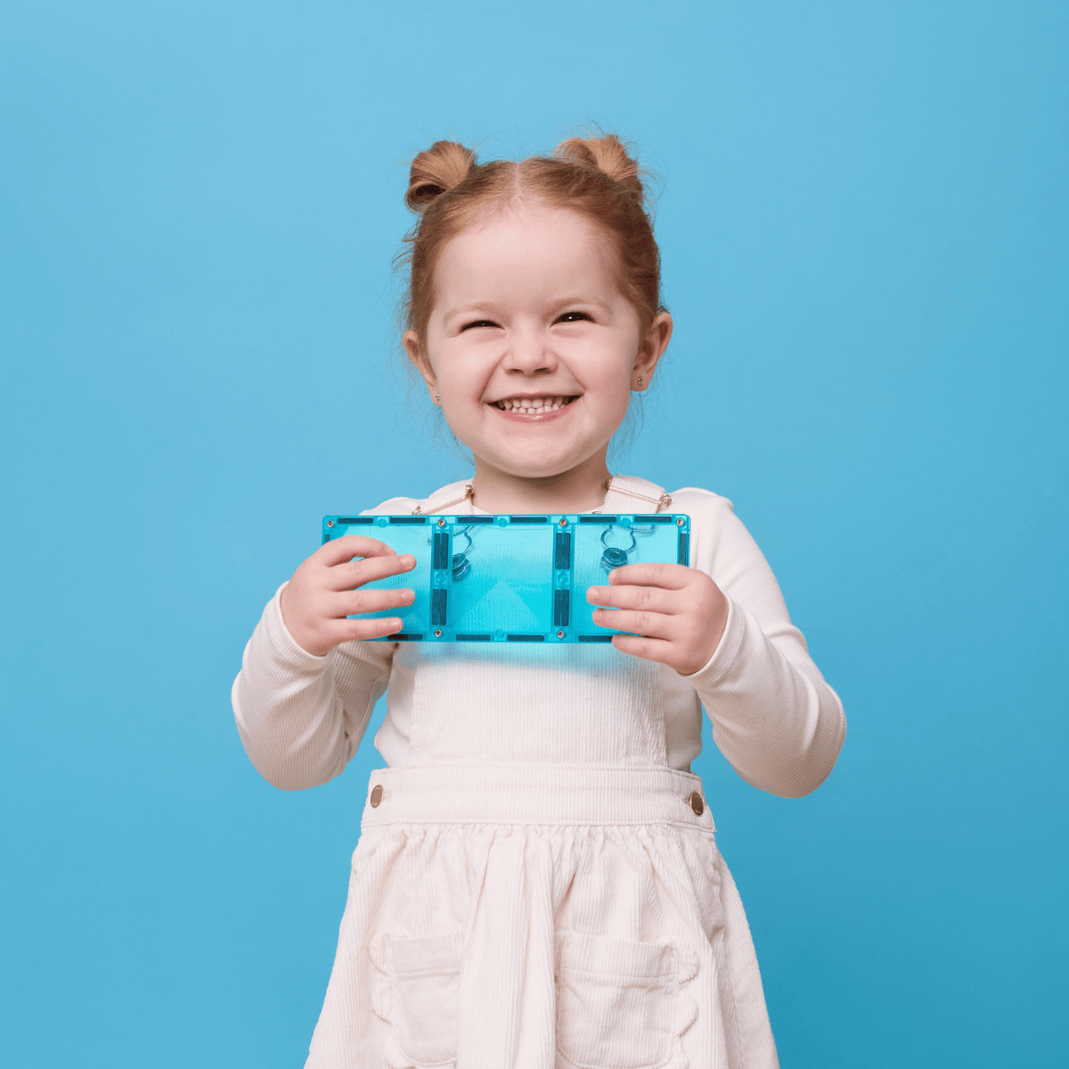 Young girl holding a blue transparent box 